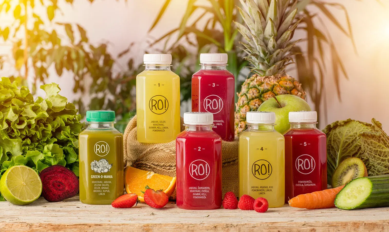 RO! cold-pressed juice bottles with fresh fruit and vegetables in Belgrade